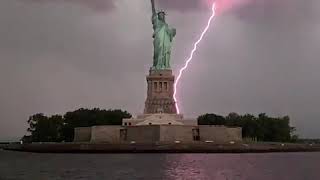 Statue of Liberty lit up by lightning [upl. by Akenom]